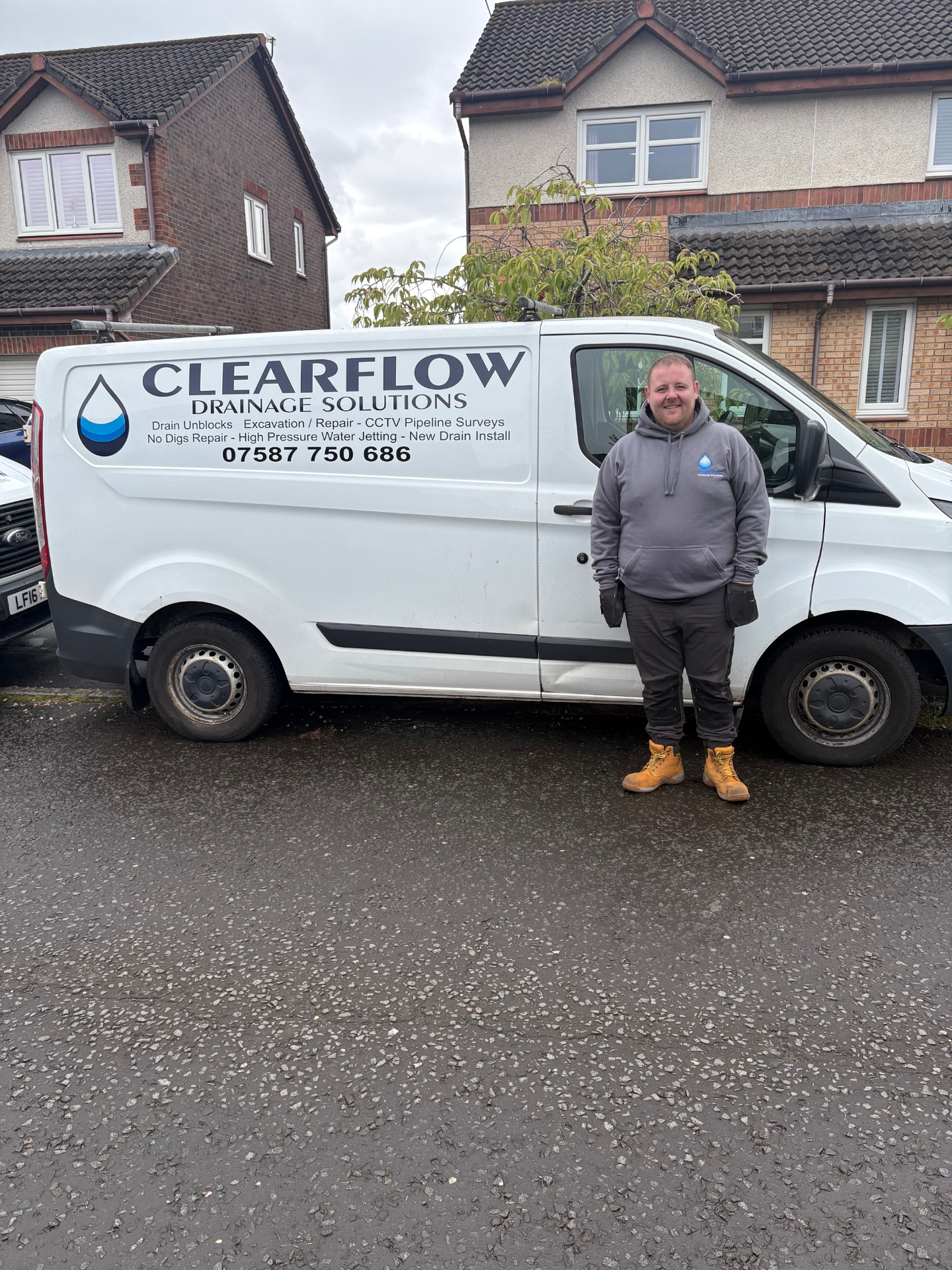 David standing beside a ClearFlow van in Glasgow